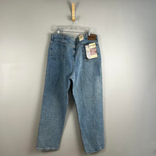 Load image into Gallery viewer, Wrangler relaxed fit men’s jeans
